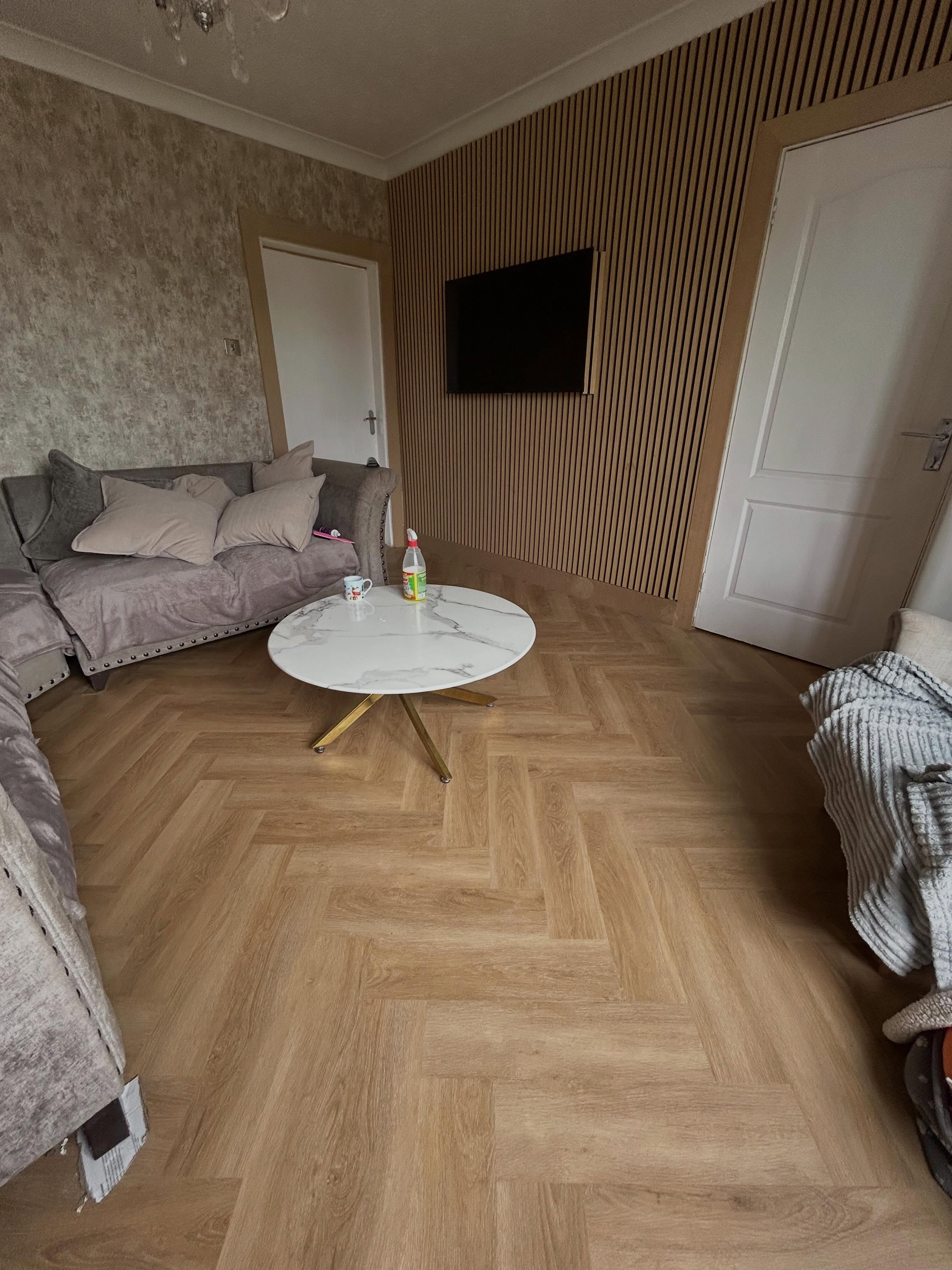 Herringbone flooring installation in Bellshill with new MDF skirting