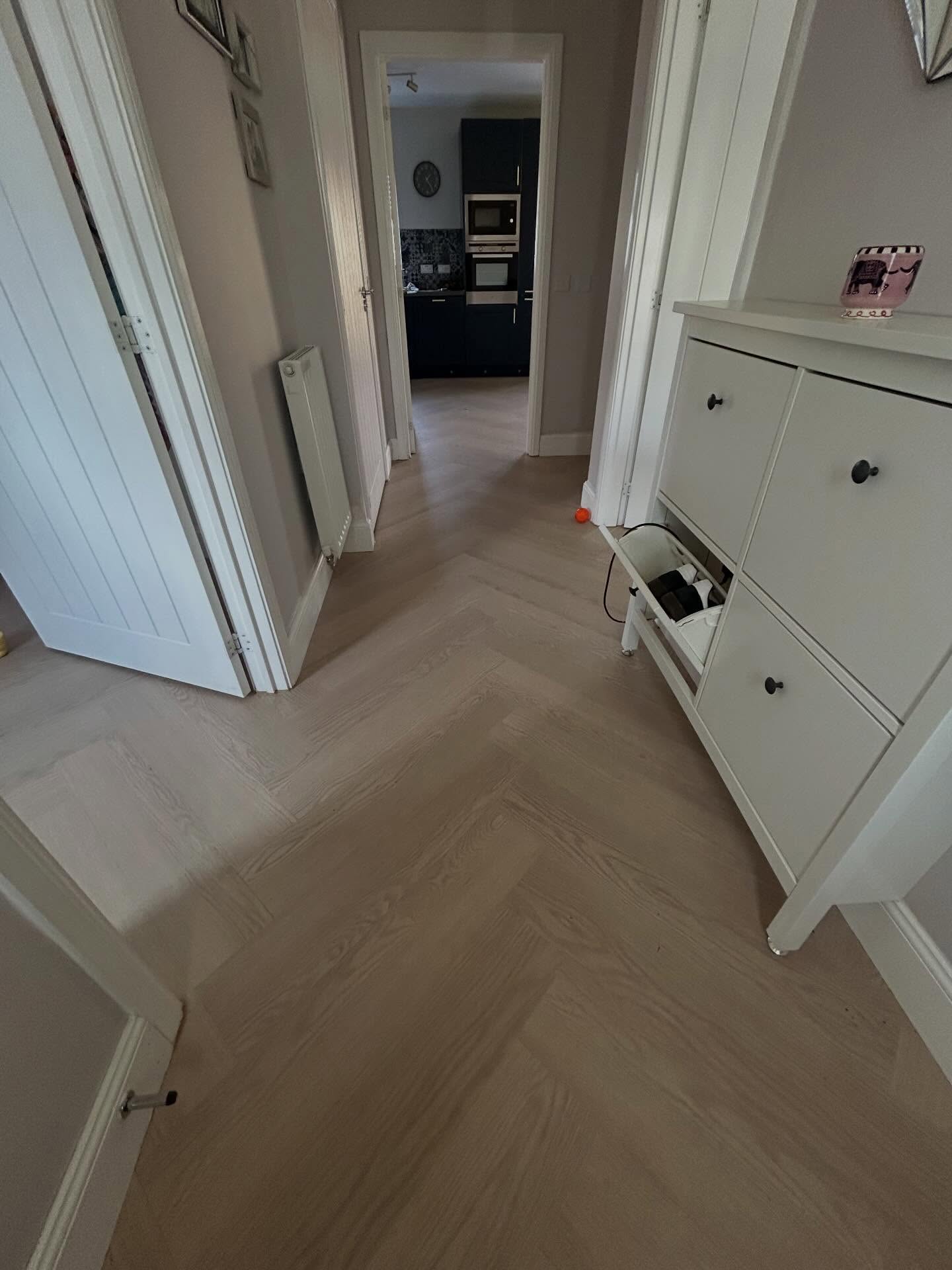Seamless herringbone flooring installation detail